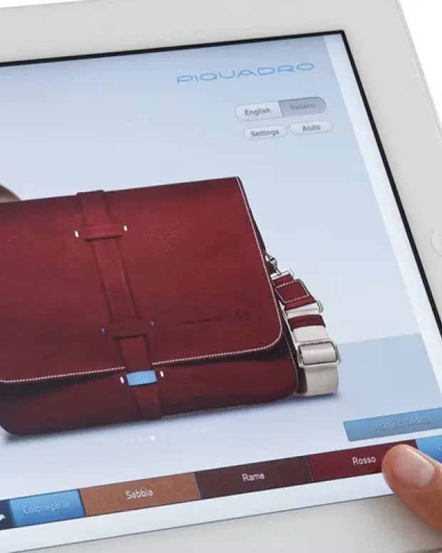 The Sartoria app on an iPad, with a red leather bag