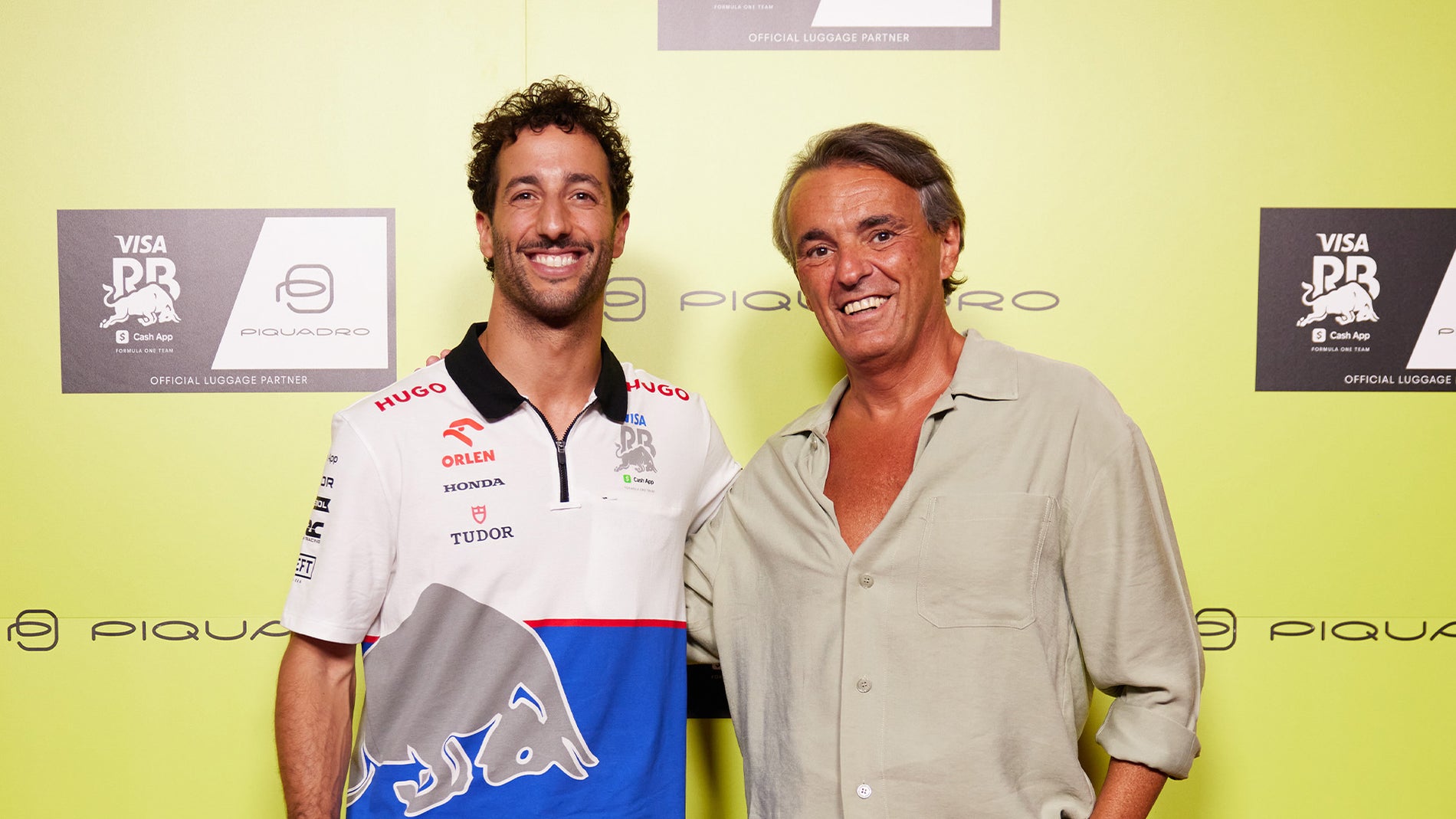Marco Palmieri, founder of Piquadro, and Daniel Ricciardo, F1 driver for RC, at the Piquadro event in Milan