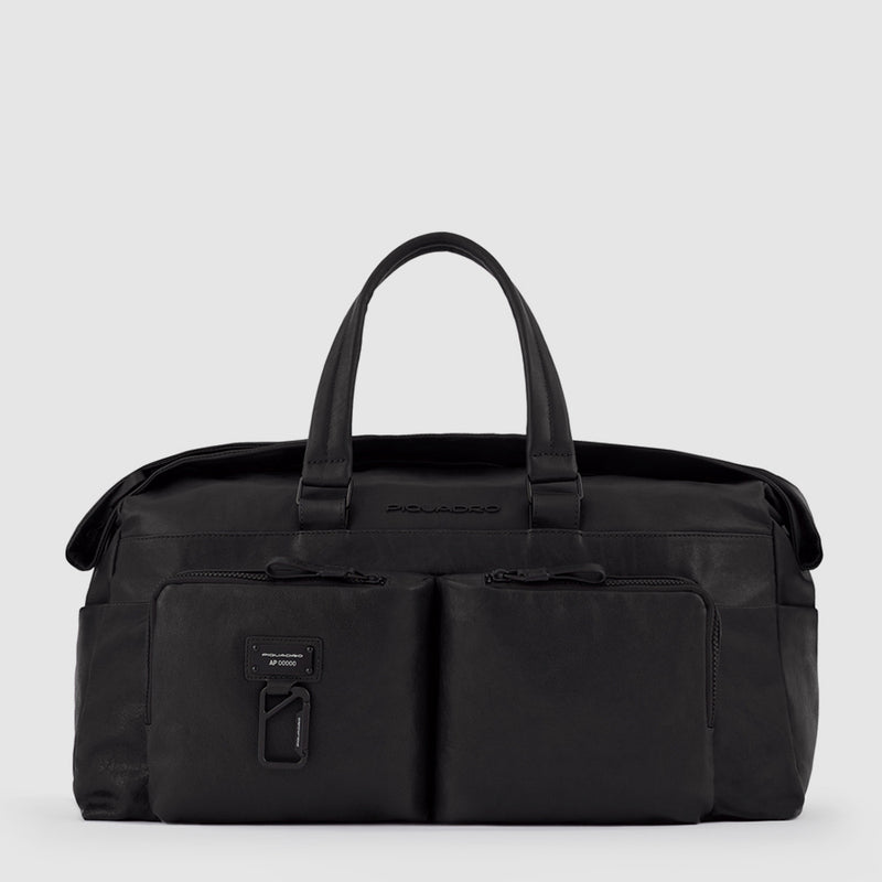 Duffel bag with trolley strap