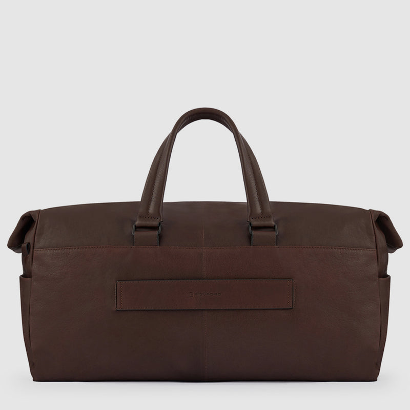 Duffel bag with trolley strap