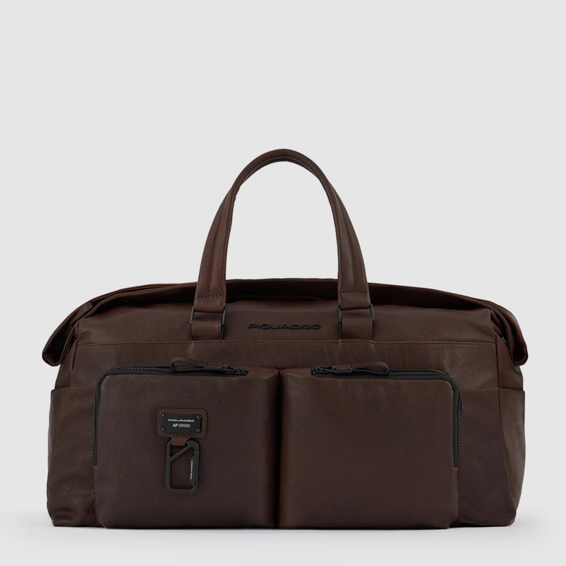 Duffel bag with trolley strap