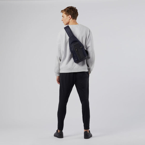 Sling bag in recycled fabric with LED light