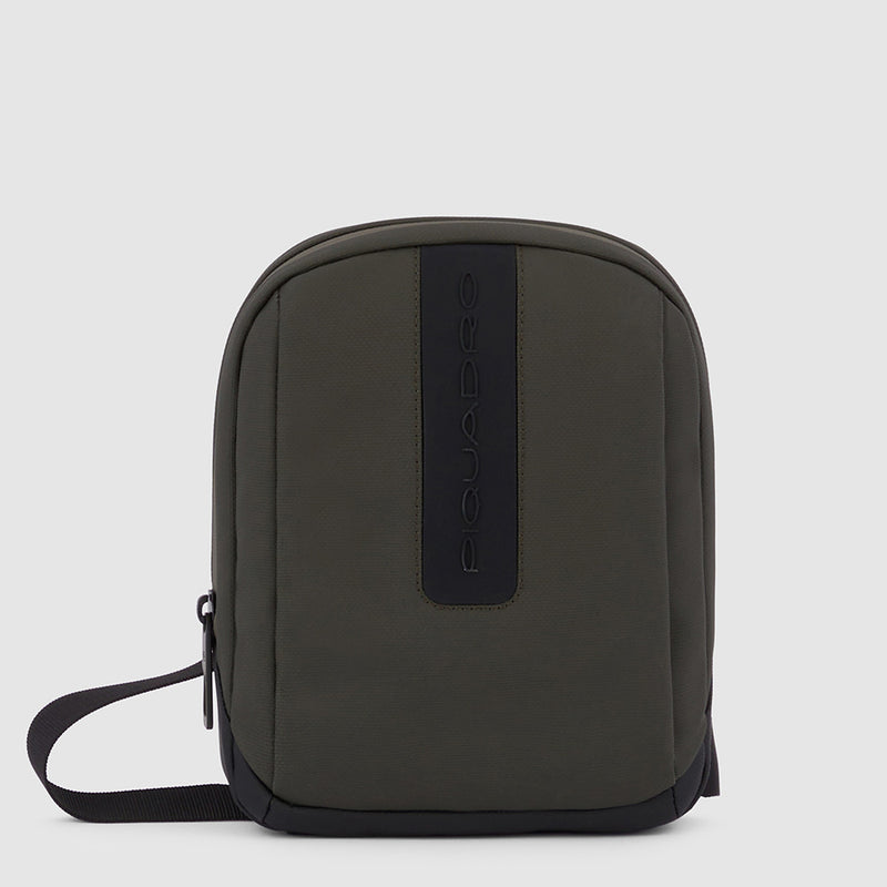 Crossbody bag with water resistant pocket
