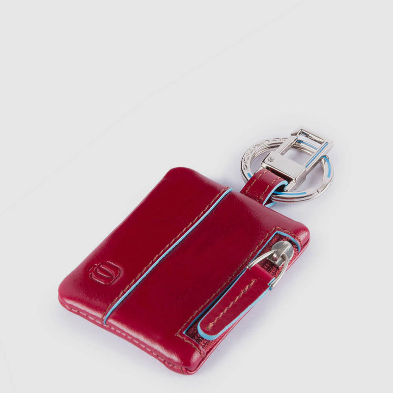 Keychain with CONNEQU and side zipped pocket