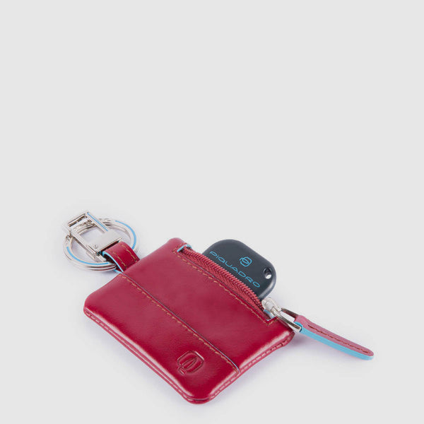 Keychain with CONNEQU and side zipped pocket